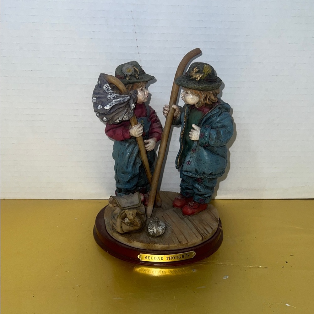 Whimsical Travelers Sculpture with Blue and Red Accents